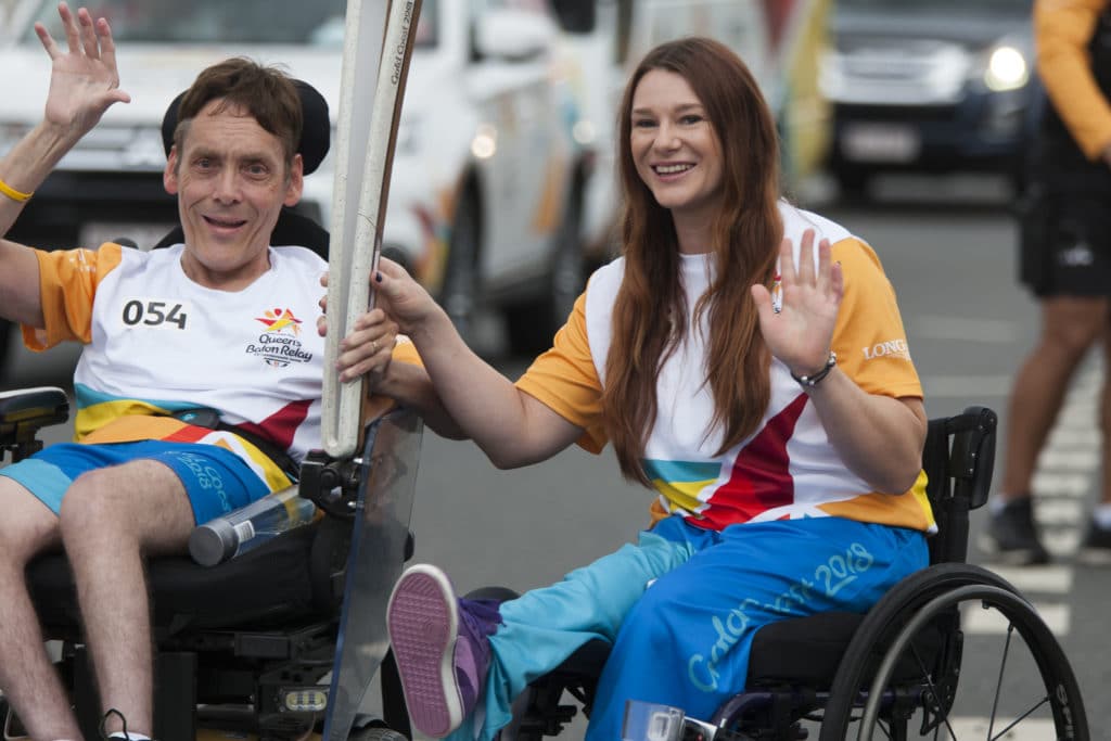 Peter Tully passes the Baton to Susan Seipel. Photo by Jeremy Sutton ...