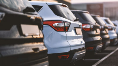 cars parked in row on outdoor parking